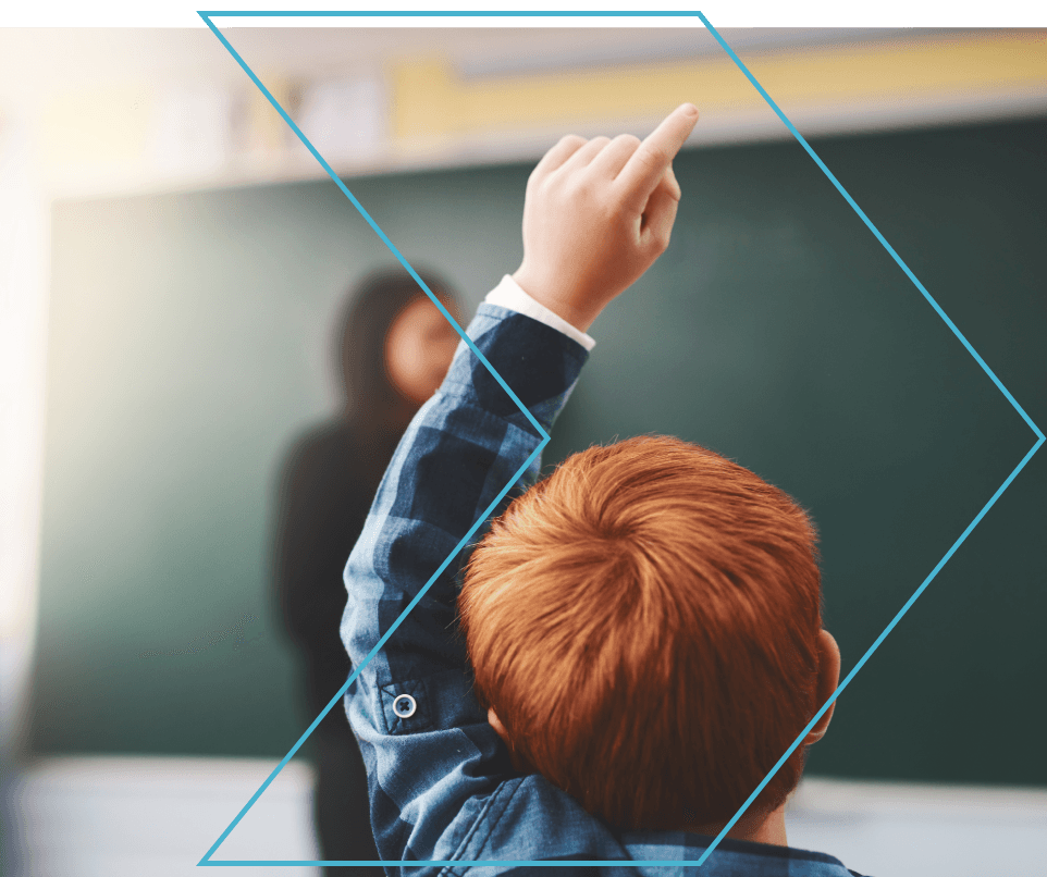Student raising hand in classroom